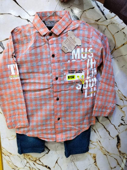 Plaid shirt with visible brand tags on a marble surface