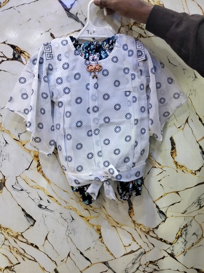 White blouse with blue floral patterns
